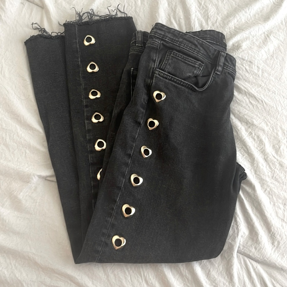 Washed black Zara denim with heart cutouts / metal rivets